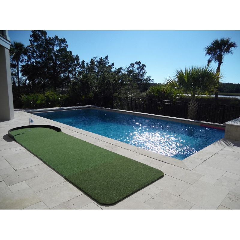 Big Moss Golf Commander Patio Series Putting &amp; Chipping Green in 15x4 foot option shown outdoors by a pool.