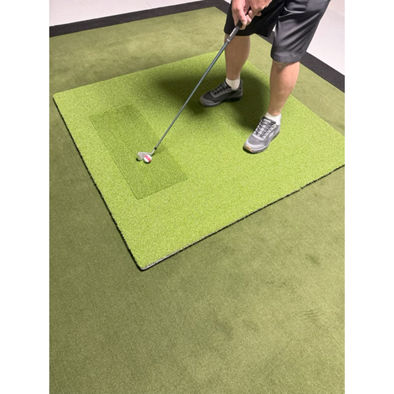 Big Moss Pure Flight MAX Hitting Mat golfer addressing the ball on the Pure Flight hitting area.
