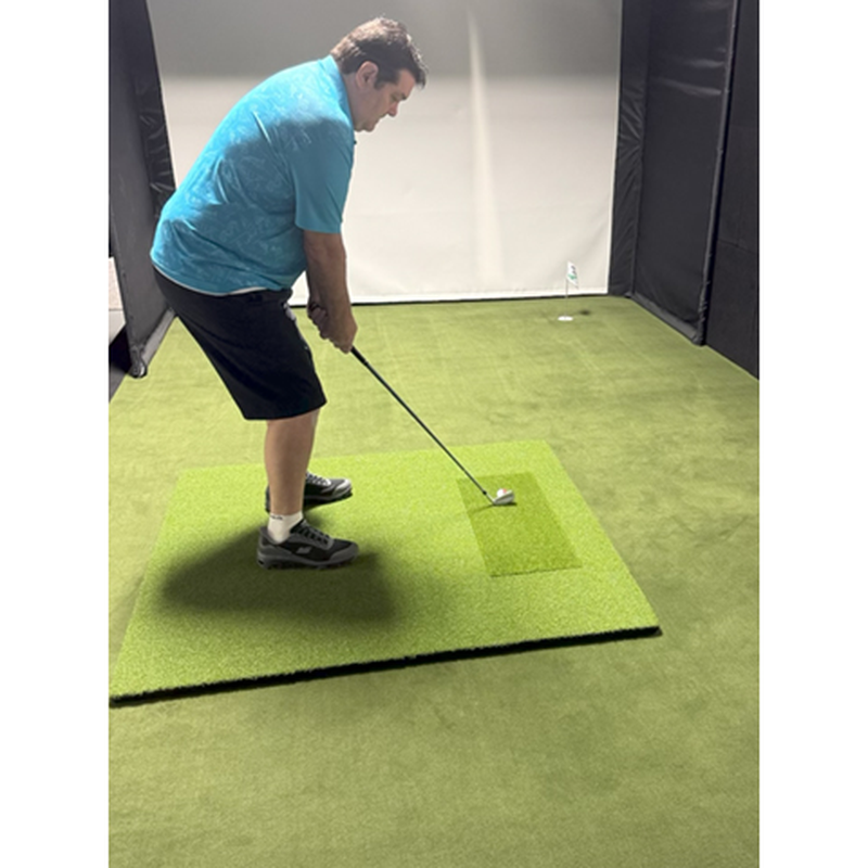 Big Moss Pure Flight MAX Hitting Mat in a golf simulator bay.