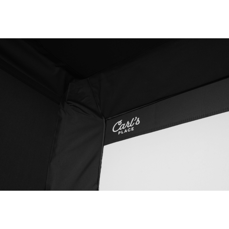 Carl's Place C-Series Pro Golf Simulator Enclosure Kit with Impact Screen top left corner.