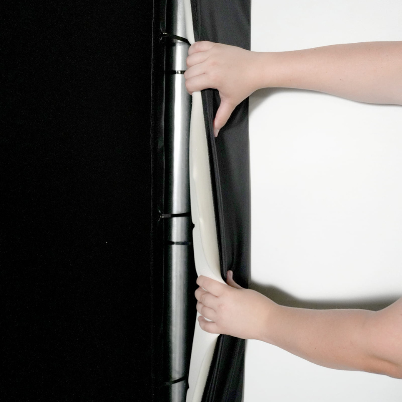 Foam Inserts being installed on the Carl's Place C-Series Pro Golf Simulator Enclosure Package framing foam install.