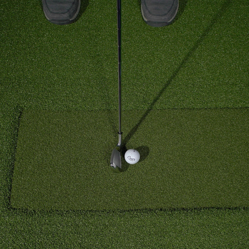 Carl&#39;s Place HotShot Golf Hitting Mat with Divot Strip and golf club and ball.