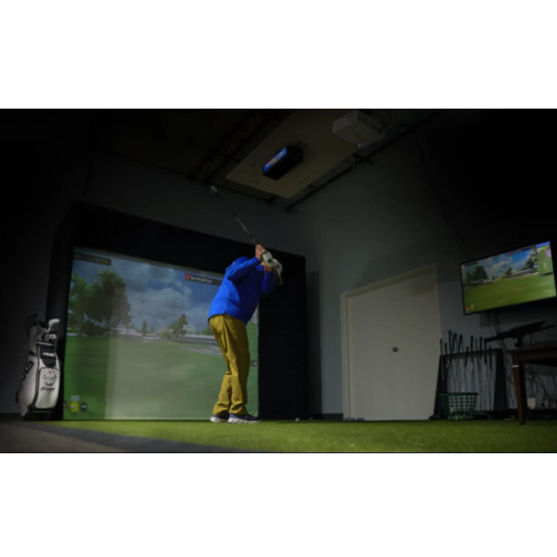 ES Eagle Sim ceiling mounted above a golfer in a home golf simulator bay.