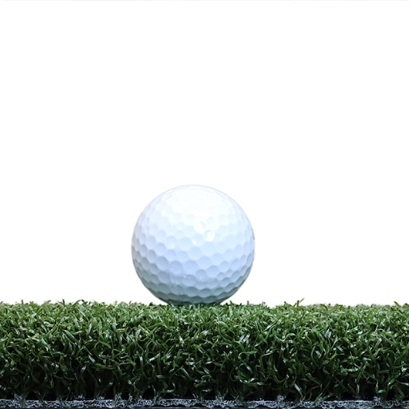 EZTee Hybrid Hitting Strip single golf ball on turf.