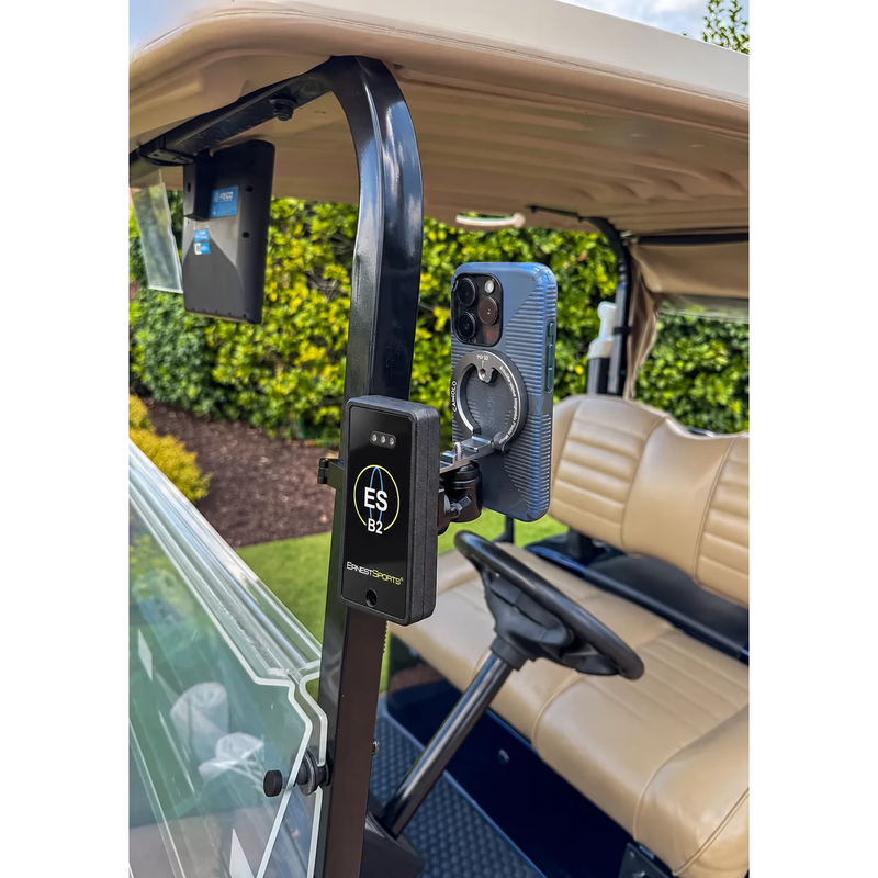 Ernest Sports ESB2 mounted on a golf cart rail with a phone beside it.