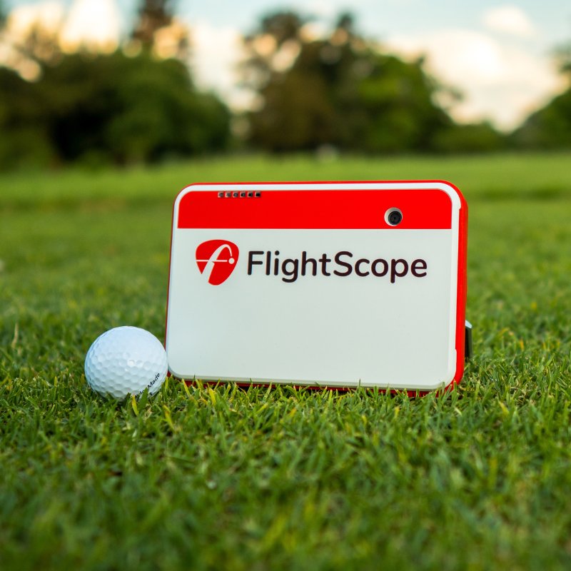 FlightScope Mevo+ Launch Monitor front view with golf ball.