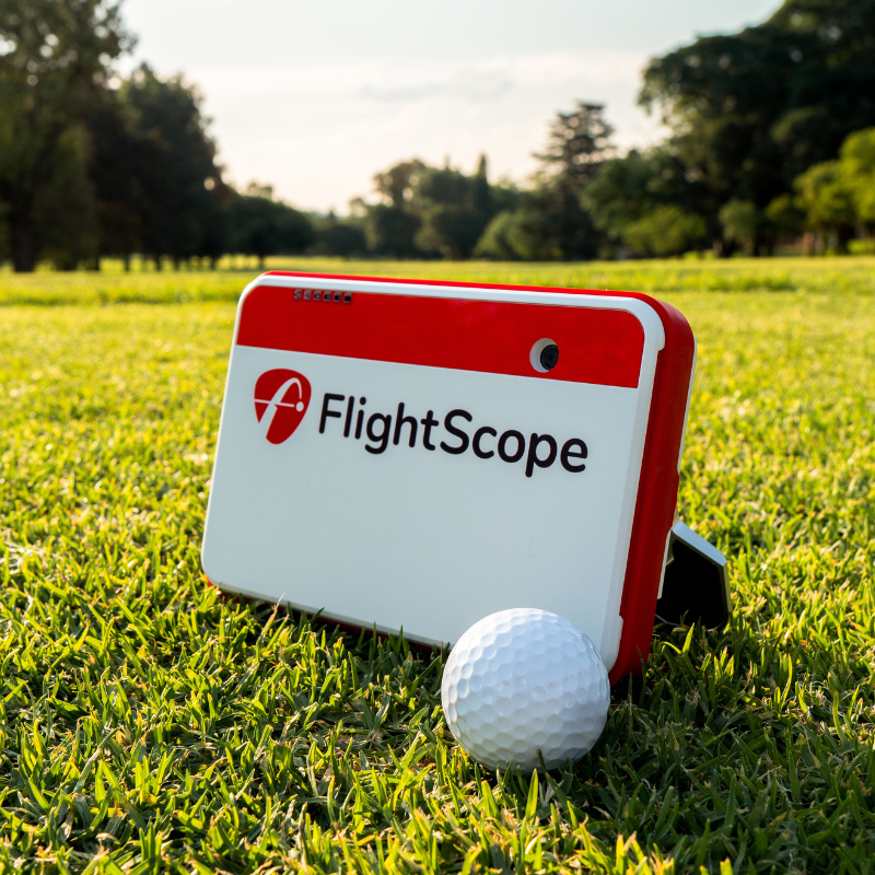 FlightScope Mevo+ Launch Monitor side view with golf ball.