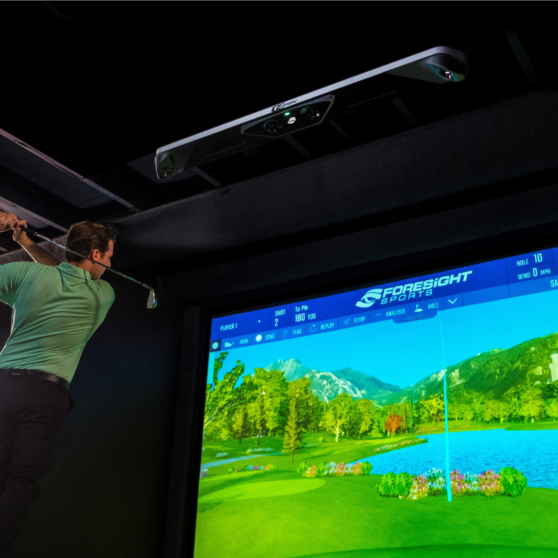 Foresight Sports GCHawk Launch Monitor ceiling mounted with golfer.