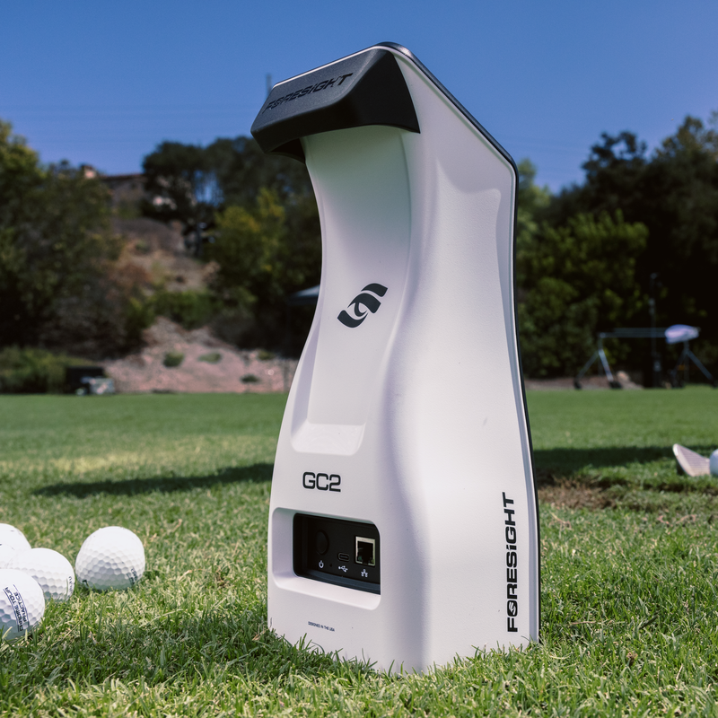 Foresight Sports GC2 Launch Monitor on the range with golf balls.