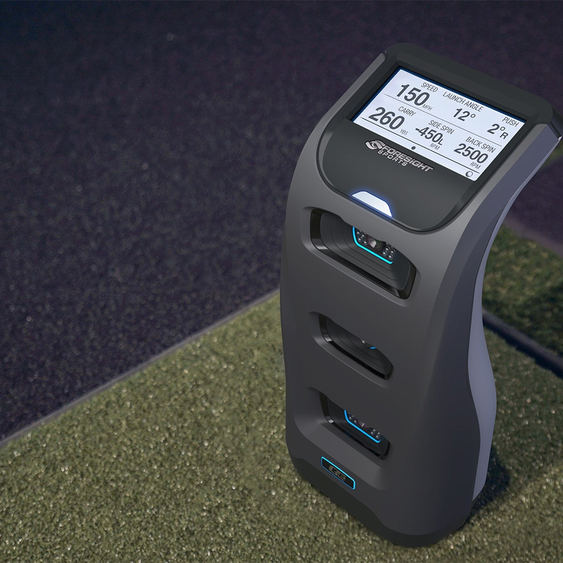 Foresight Sports GC3 Buddy Bundle on turf with golf ball.