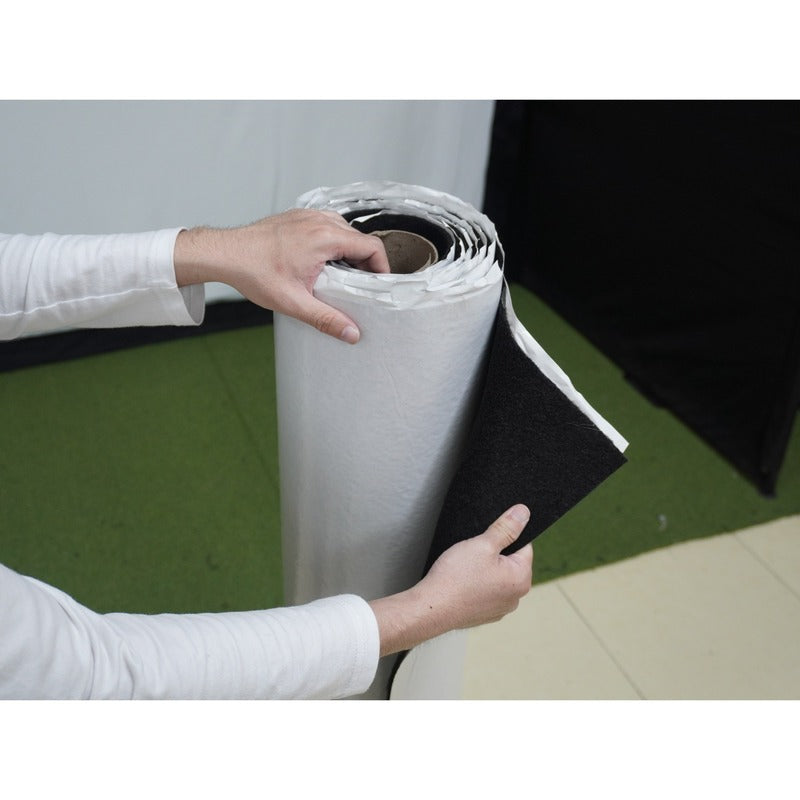 Impact Sports Felt Wall Covering Roll with the release liner peeled back to show the black felt face.