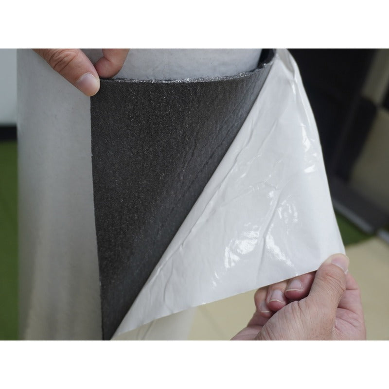 Impact Sports Felt Wall Covering Roll peeling the adhesive backing from the felt.