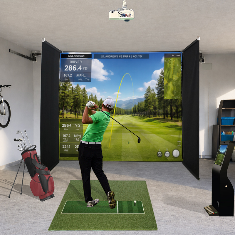 Impact Sports Motorized Drop-Down Golf Simulator Enclosure in a garage with a golfer mid-swing and shot data on the screen.
