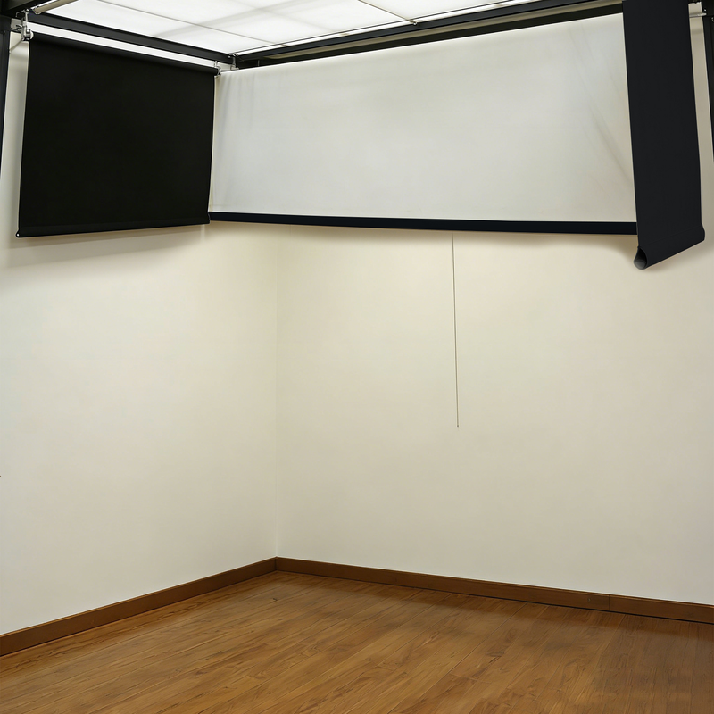 Impact Sports Motorized Drop-Down Golf Simulator Enclosure with the impact screen and side walls retracted to the ceiling.