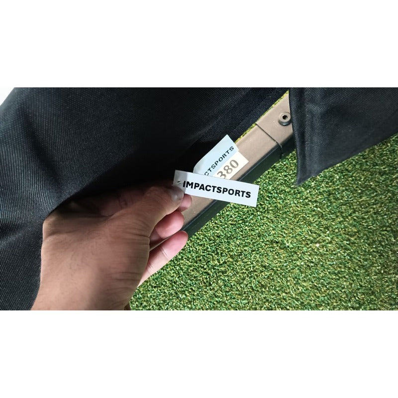 Impact Sports branded label sewn into the black enclosure fabric of the Standard Golf Simulator Enclosure.