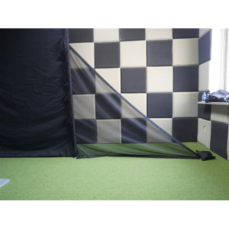 Impact Sports Triangular Net Barriers (Set of 2) installed on a simulator enclosure with the weight bag resting on the floor.