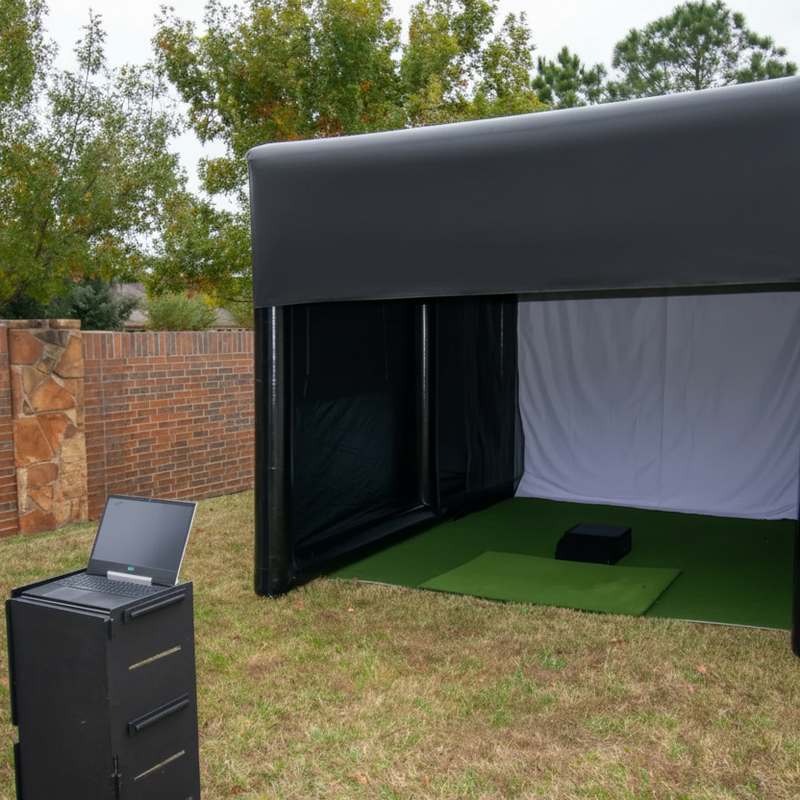 Inflatable golf simulator enclosure 12x16 golf simulator setup with laptop.