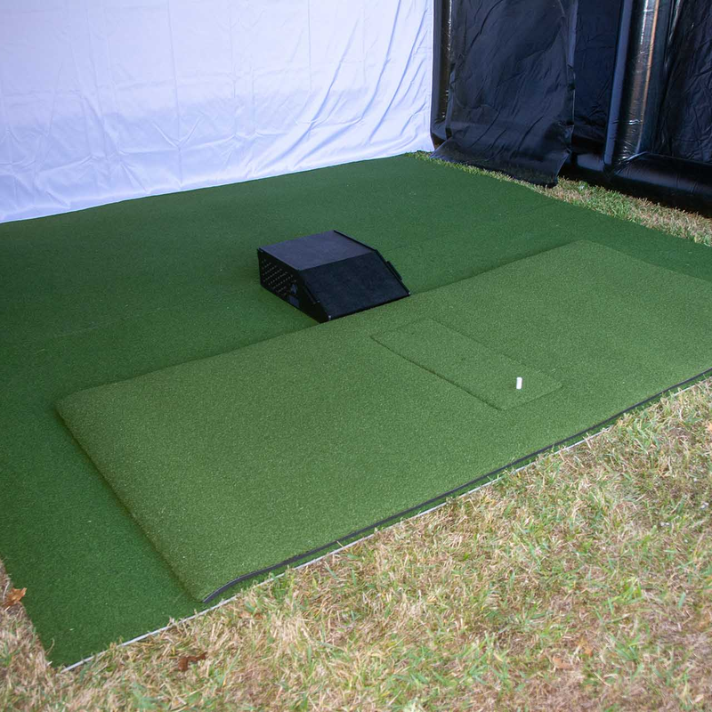 Inflatable golf simulator enclosure 16x16 interior turf and hitting area.