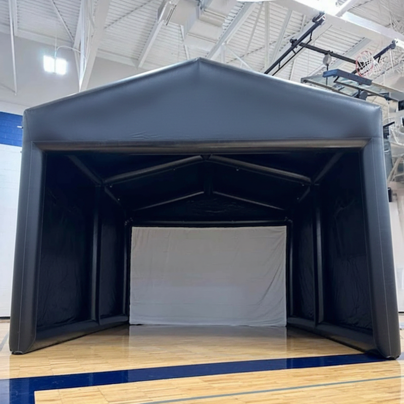 Inflatable golf simulator enclosure 16x20 indoor installation angled view.