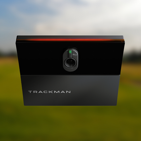 Trackman iO Launch Monitor front view with golf course in background.