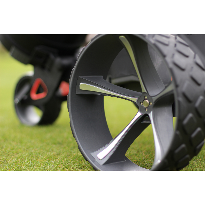 Motocaddy M1 DHC Electric Caddy wheels lifestyle view.