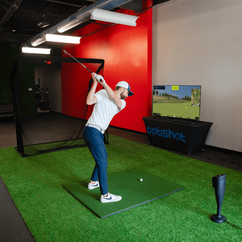 OptiShot Nova Series Golf In A Box 2 Simulator golfer taking a swing.