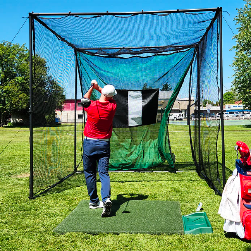 Parbuster Bentley Golf Driving Range Net outdoors with golfer finishing swing.