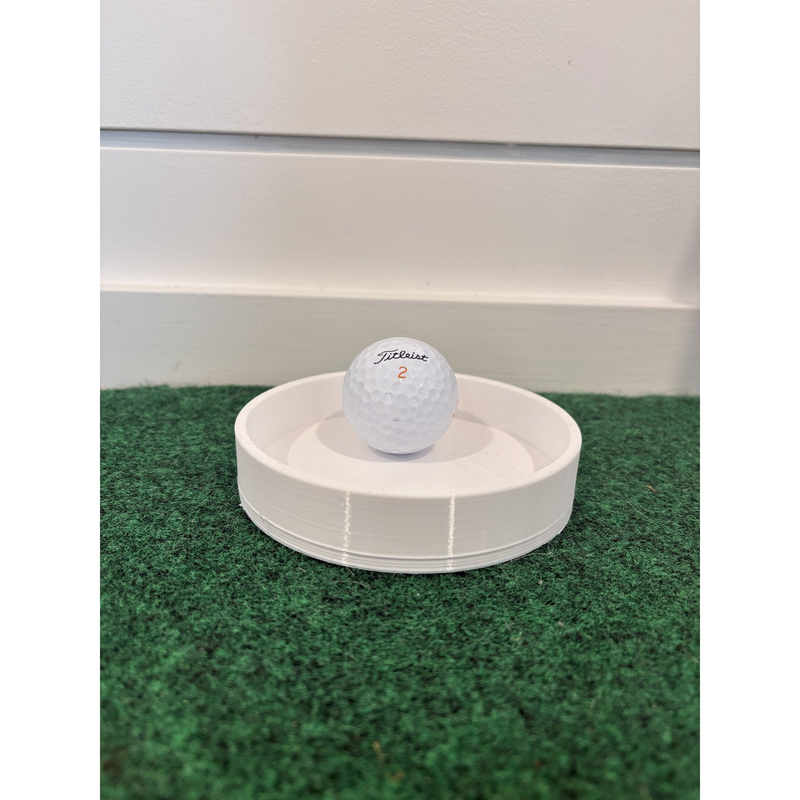 RadTee Golf Simulator Putting Cup on putting turf with golf ball.