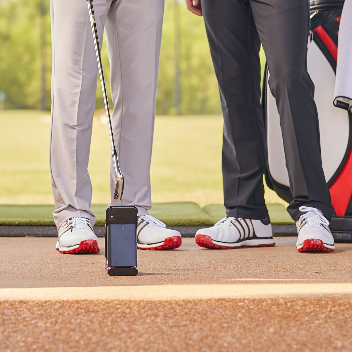 Rapsodo Mobile Launch Monitor with golfers on a driving range