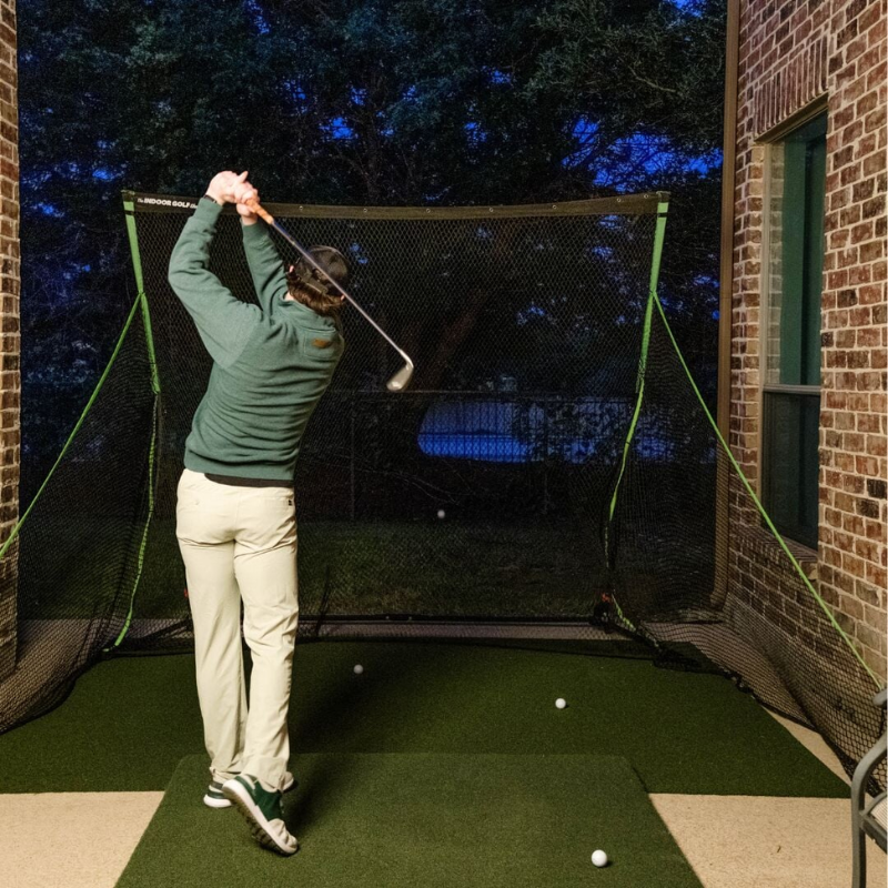 SIGPRO Golf Net with golfer on patio.