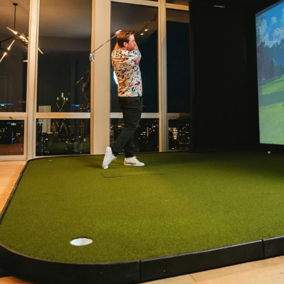 SIGPRO Golf Simulator Flooring with golfer swinging.
