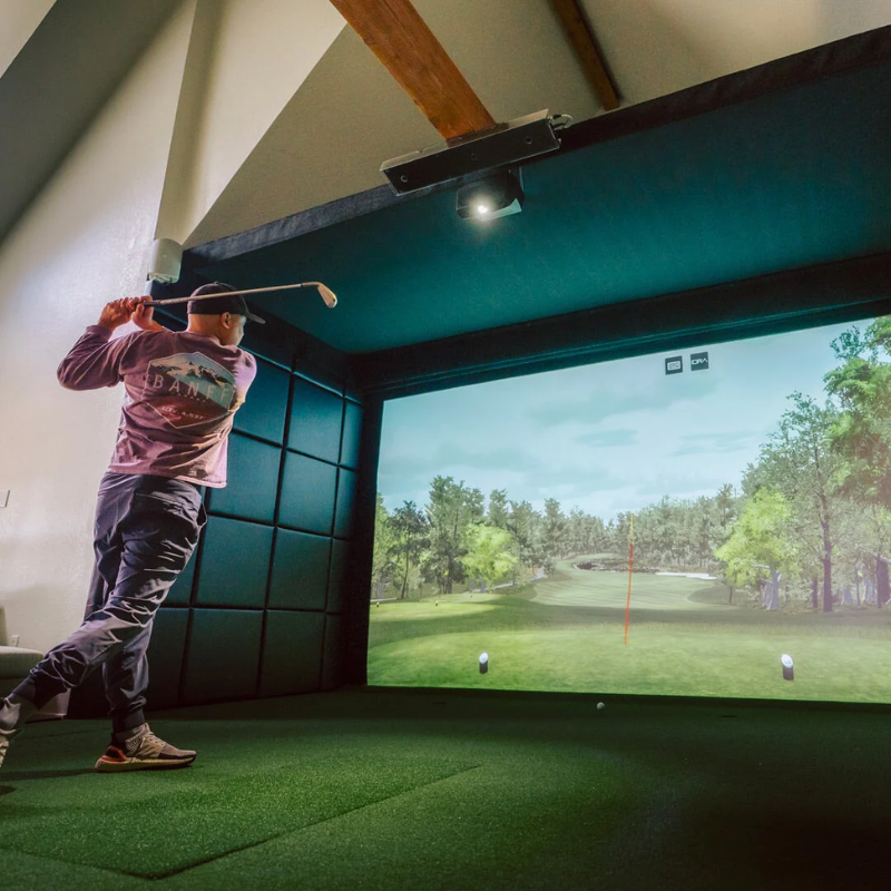 SIGPRO Golf Simulator Wall Padding in a simulator studio with golfer.
