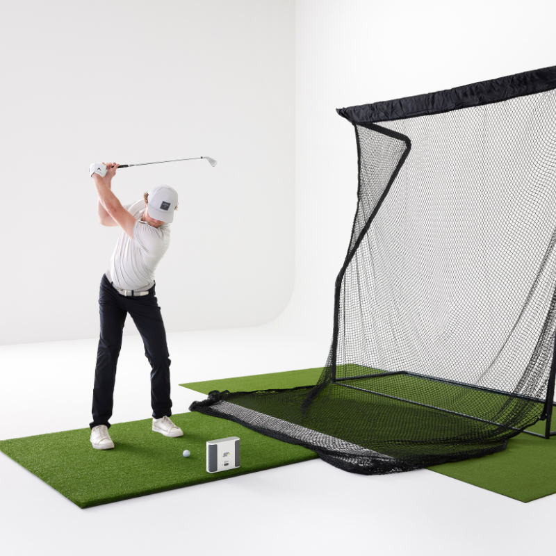 SkyTrak+ Launch Monitor with a hitting net and golfer.