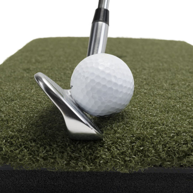 Spornia ProStrike Commercial Golf Mat with golf club and ball close view.