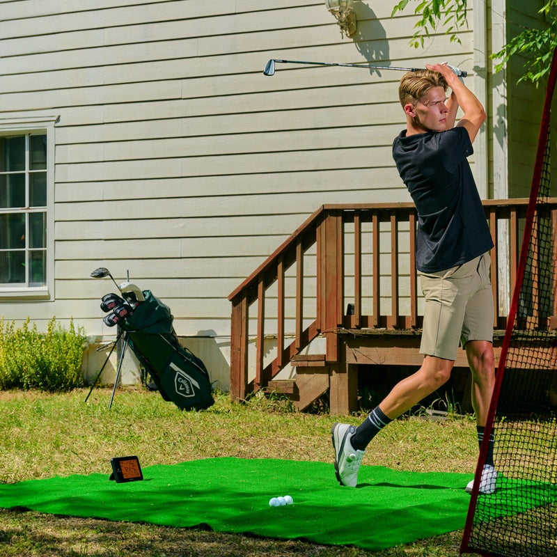 Swing Caddie SC300i Launch Monitor man swinging outdoors.