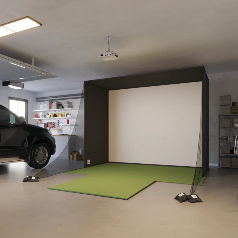 SwingBay Enclosure Golf Simulator Package side view in garage with SwingTurf 5x5 Hitting Mat.