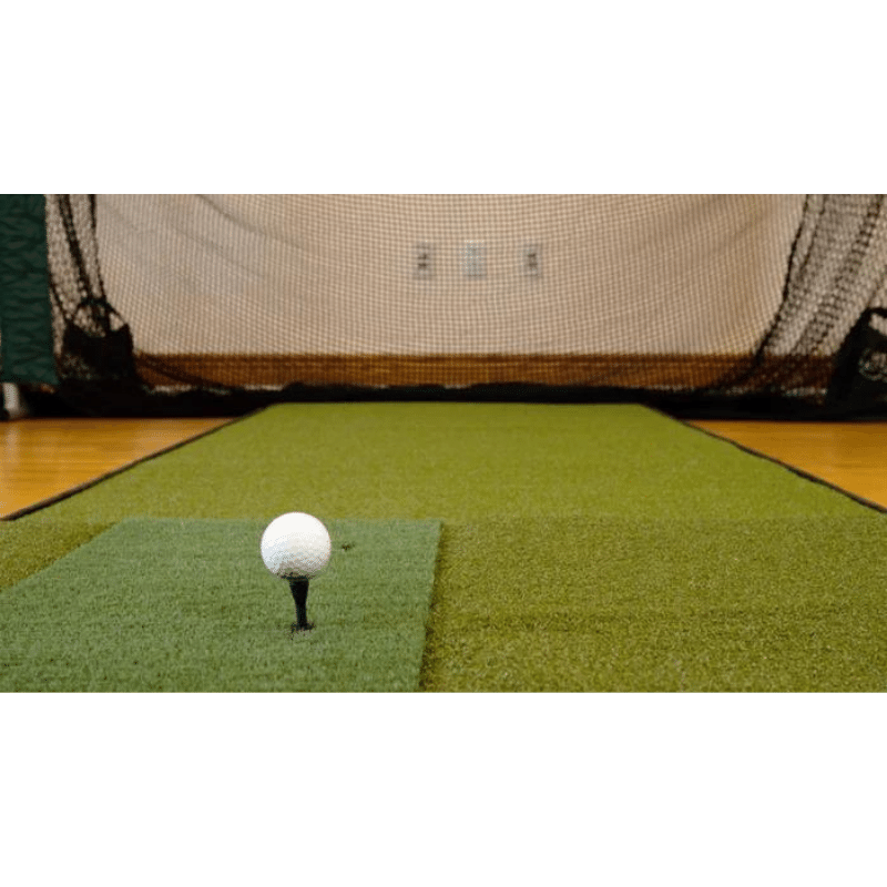 The Net Return Platinum V2 Golf Package turf with golf ball and tee.