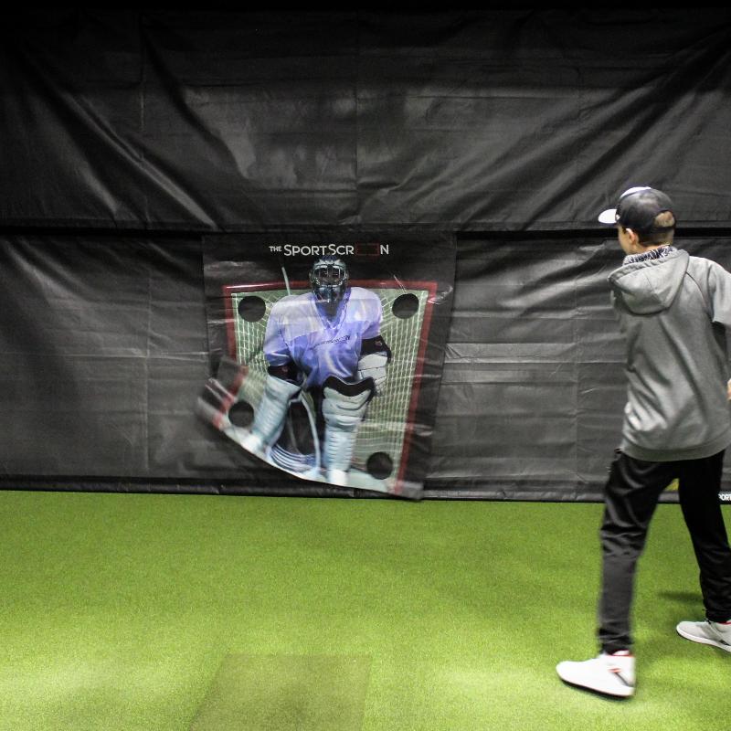 The SportsScreen Parlour Series Golf Simulator Enclosure studio with lacrosse multisport attachment.