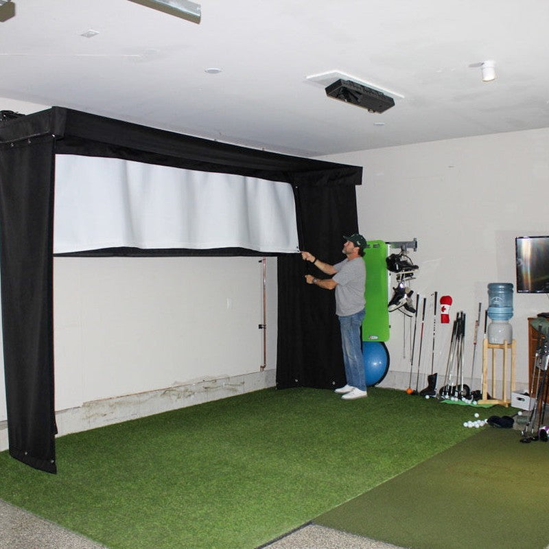 The SportsScreen Vanish LITE Series Golf Simulator Enclosure half rolled down.