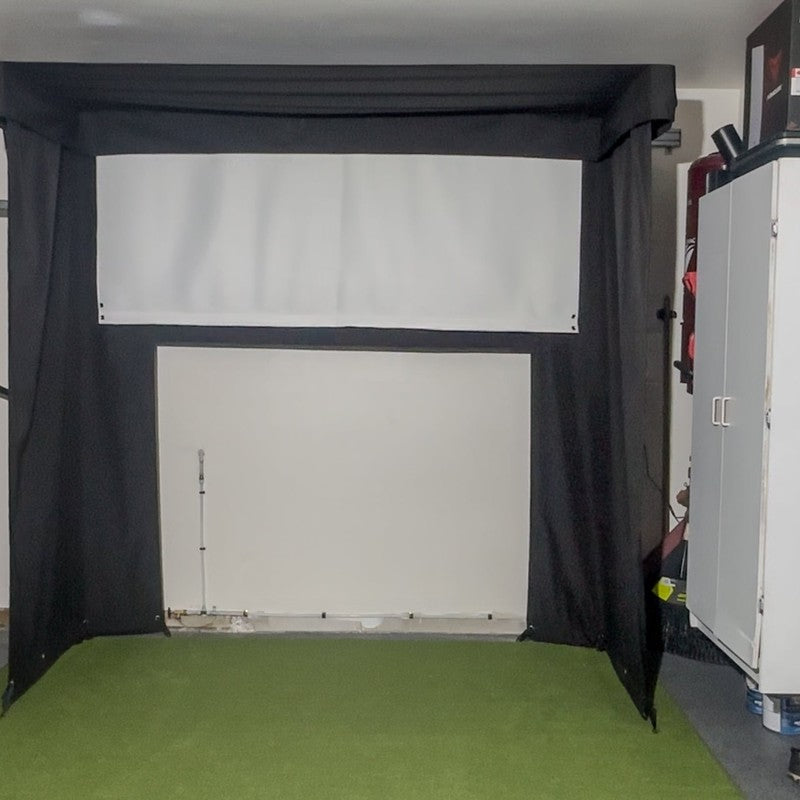 The SportsScreen Vanish LITE Series Golf Simulator Enclosure half rolled up while wall mounted.