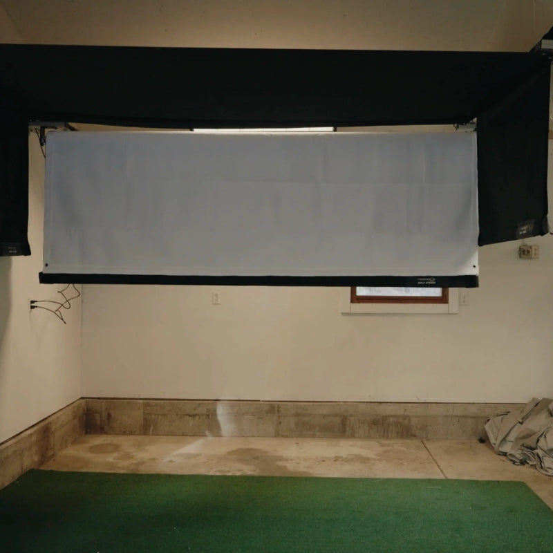 The SportsScreen Vanish Series Golf Simulator Enclosure enclosure halfway retracted.