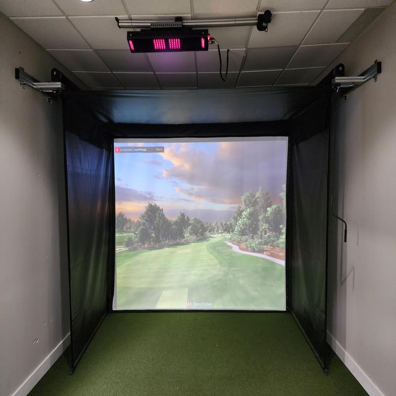 The SportsScreen Vanish Series Golf Simulator Enclosure tight room front view.
