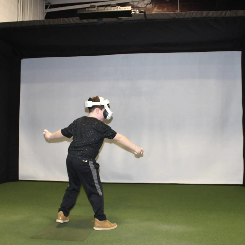 The SportsScreen Vanish Series Golf Simulator Enclosure vr space used indoors.