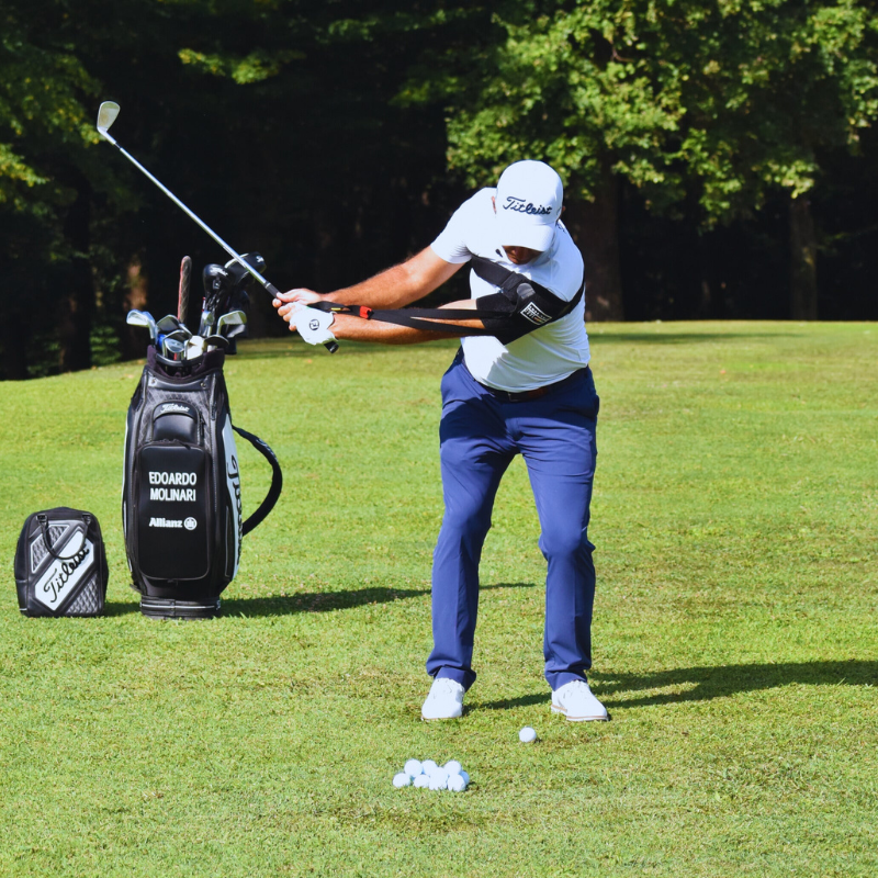 Tour-Feel Swing Trainer with golfer in backswing position caddie view.