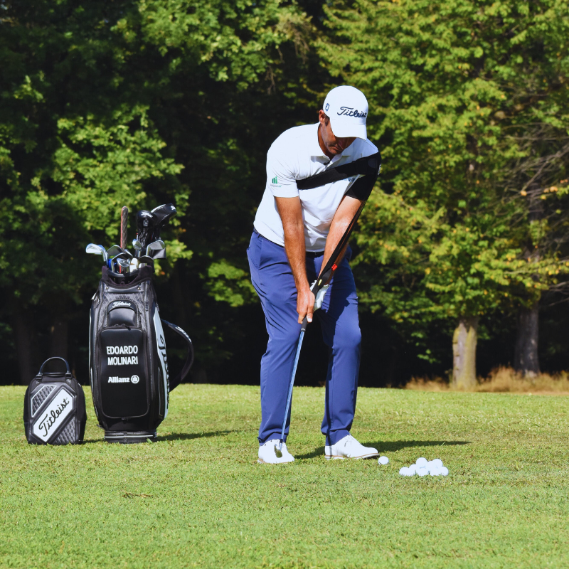 Tour-Feel Swing Trainer with golfer in takeaway position.