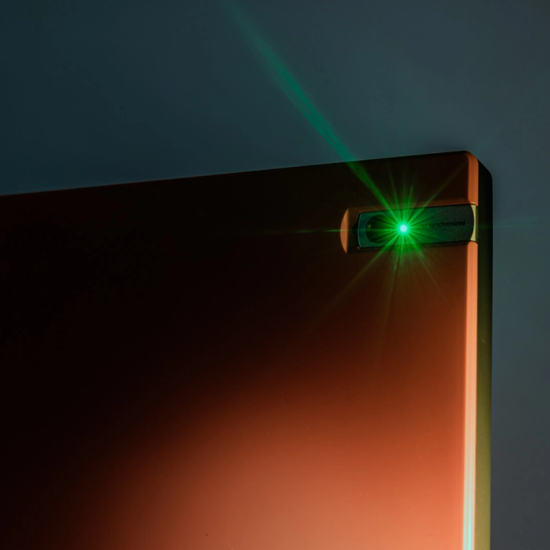 Trackman 4 Golf Launch Monitor closeup top corner with green light.