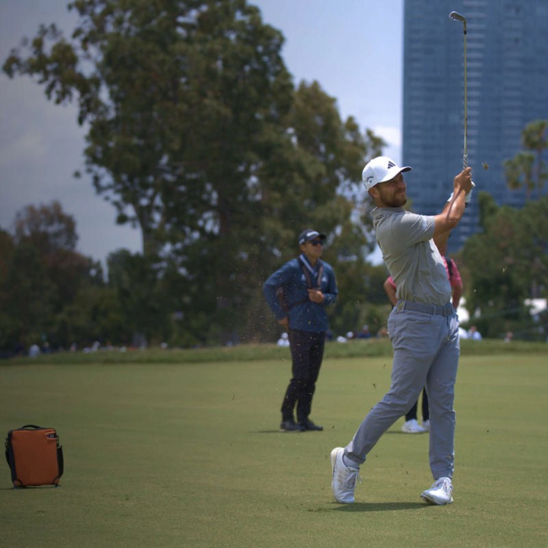 Trackman 4 Golf Launch Monitor golfer follow through shot on fairway.