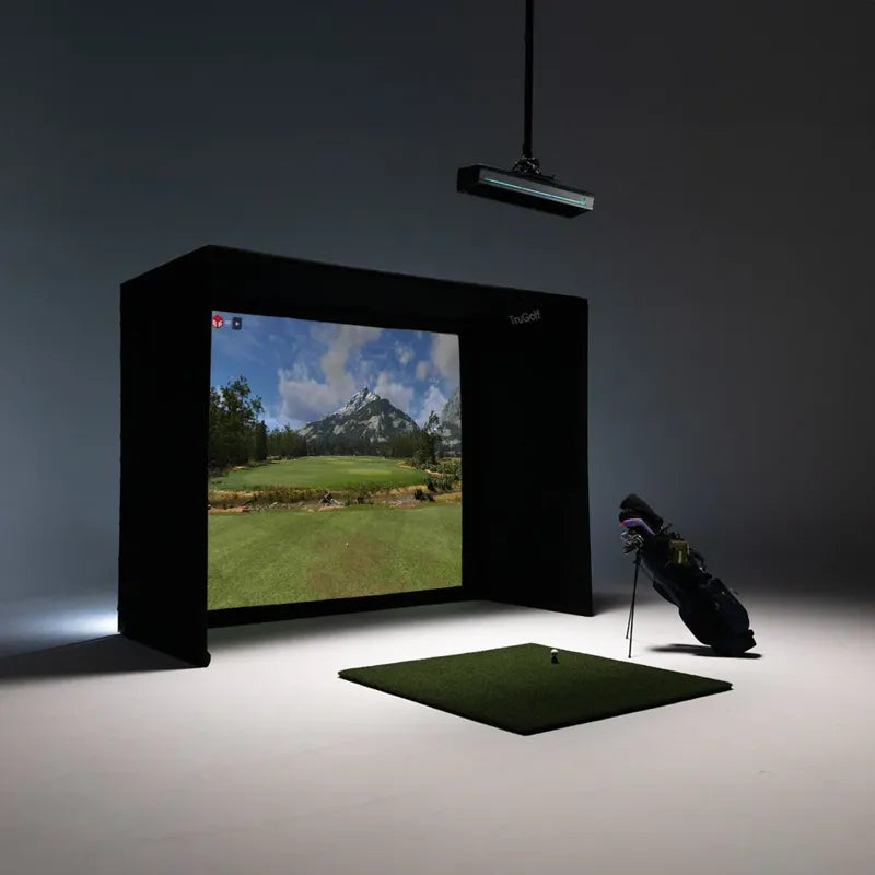 TruGolf Starter 10 golf simulator dark room with golf bag.