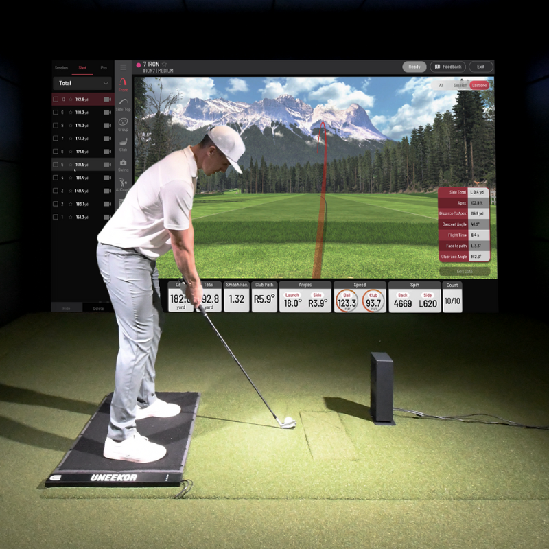 Uneekor EYE MINI LITE Launch Monitor with golfer in a simulator studio.