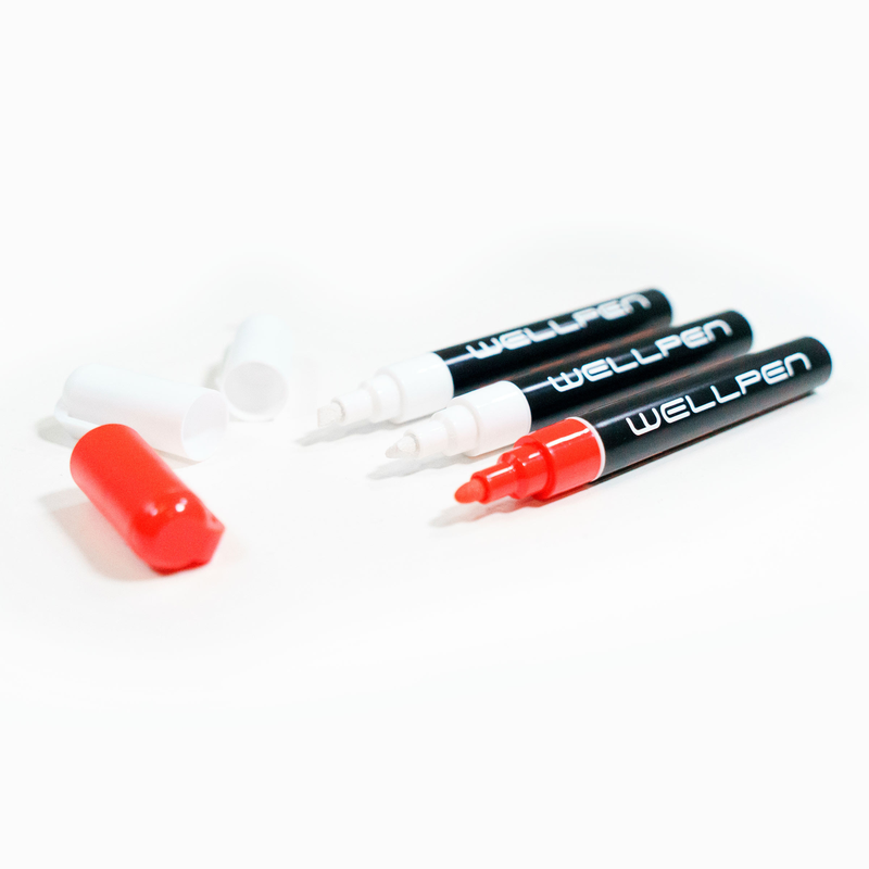 Wellpen chalk pens with caps removed.
